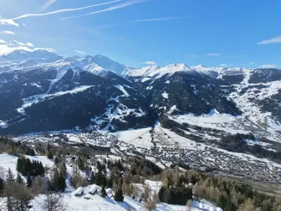 Panoramic winter view of Val de Bagnes valley from Le Gypaète, Swiss Alps near Verbier